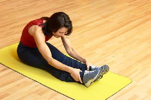 woman stretching before workout