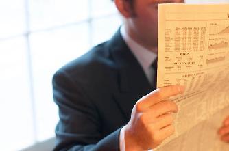 Man reading newspaper